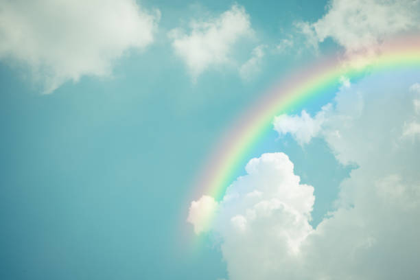 Nature cloudscape with blue sky with rainbow stock photo