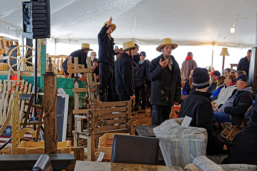 PENRYN PENNSYLVANIA - MARCH 18, 2017: Amish volunteers sell furniture and crafts at the annual  auction 
