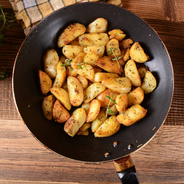 Fried potatoes Fried potatoes with rosemary and thyme fried potato stock pictures, royalty-free photos & images