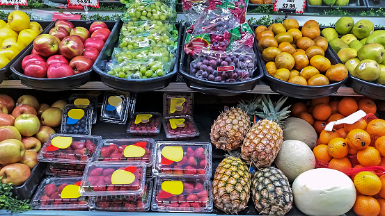 Picture of various fruits and vegetables in a supermarket.  Picture was taken in interior Alaska.