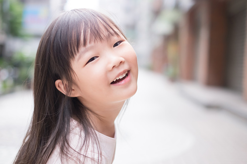 young cute girl smile to you happily, asian