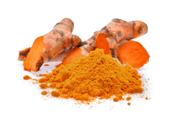 istock Turmeric roots with turmeric powder isolated on white background 655610524