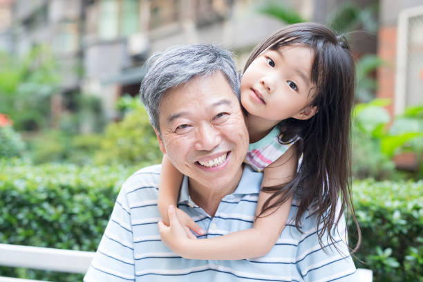 istock old man with granddaughter 655610908