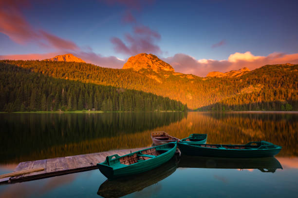 colored clouds in the morning on the lake Black in the national park Durmitor, Montenegro colored clouds in the morning on the lake Black in the national park Durmitor, Montenegro durmitor national park photos stock pictures, royalty-free photos & images