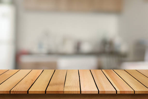 istock Wood table top on blur bokeh kitchen background can be used for display or montage your products 655616814