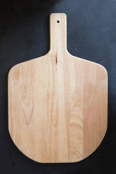 istock Wooden cutting board on black background. 655617370
