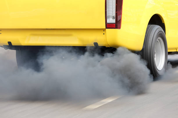 istock Air pollution from vehicle exhaust pipe on road 655617516