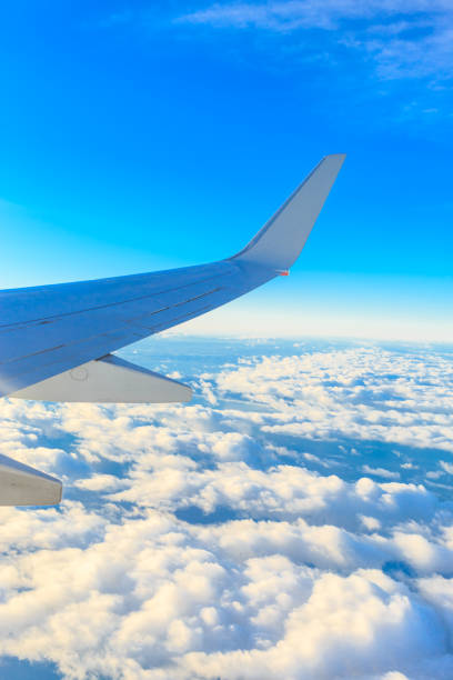 istock Airplane wing out of window 655623744