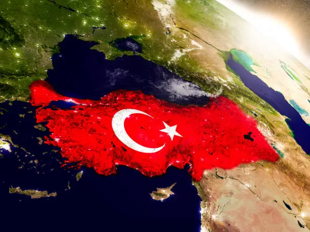 Turkey with embedded flag on planet surface during sunrise. 3D illustration with highly detailed realistic planet surface and visible city lights. 3D model of planet created and rendered in Cheetah3D software, 9 Mar 2017. Some layers of planet surface use textures furnished by NASA, Blue Marble collection: http://visibleearth.nasa.gov/view_cat.php?categoryID=1484