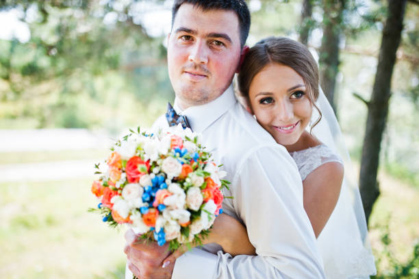 istock wedding couple on pine forest in love 655648260