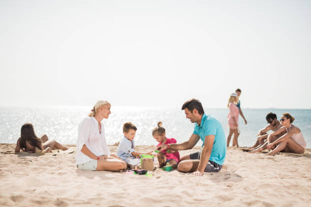istock Large group of people spending a summer day on beach. 655648584