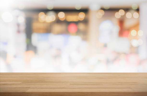 istock Wood table top and blurred restaurant interior background - can used for display or montage your products. 655651528