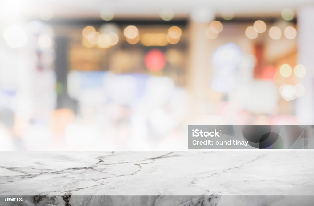 Stone table top and blurred restaurant interior background - can used for display or montage your products. Background can be used for display or montage your products Restaurant Stock Photo
