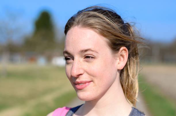 istock Attractive young blond woman outdoors in sunshine 655652526