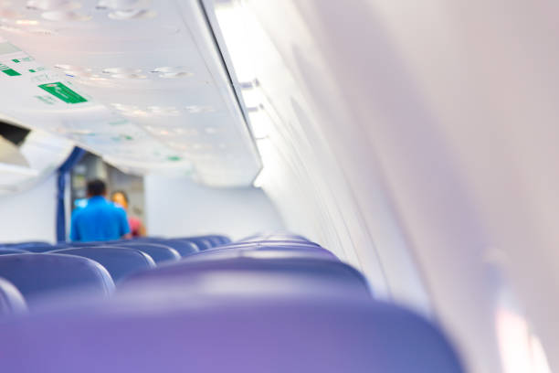 istock white clean new passenger cabin in air plane. 655652648