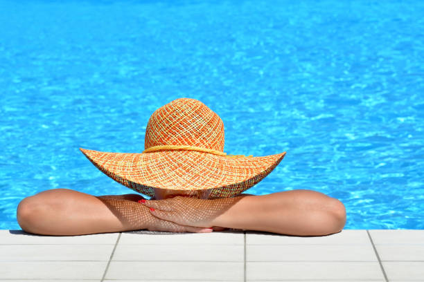 istock Real female beauty relaxing at swimming pool 655656460