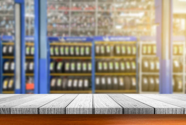 istock Wooden tabletop with blurred tires showing 655656674
