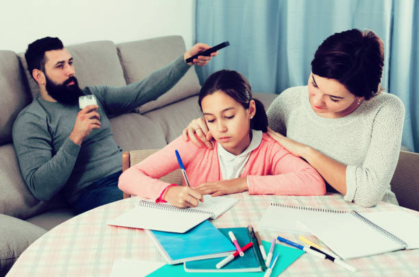 istock Mother helping daughter with homework 655659886