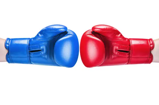 Photo of leather boxing glove red and blue isolated on white