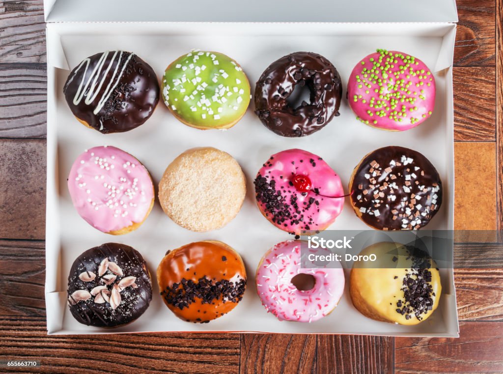 glazed donuts with different fillings glazed donuts with different fillings in the box Backgrounds Stock Photo