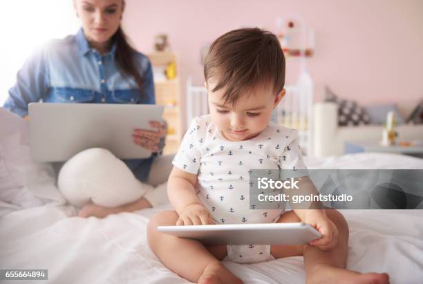 Happy Baby Spending Time With Mummy Stock Photo - Download Image Now - Baby - Human Age, Digital Tablet, Adult