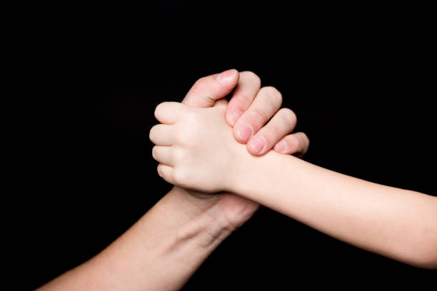 istock Father and child holding hands 655667136