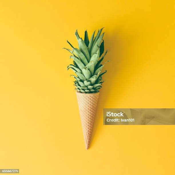 Ice Cream Cone With Pineapple Leaves On Bright Yellow Background Fruit And Candy Concept Flat Lay Stock Photo - Download Image Now