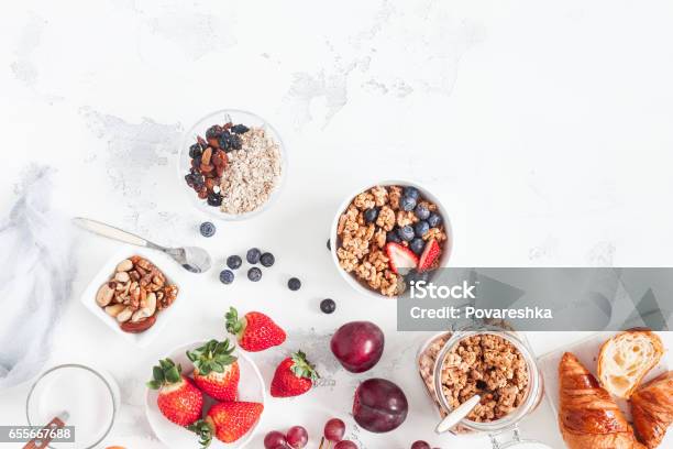 Healthy Breakfast With Muesli Fruits Berries Nuts On White Background Stock Photo - Download Image Now