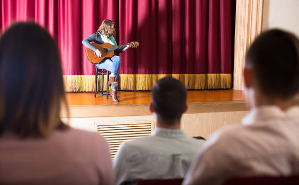 istock Group of people in concert hall 655671498