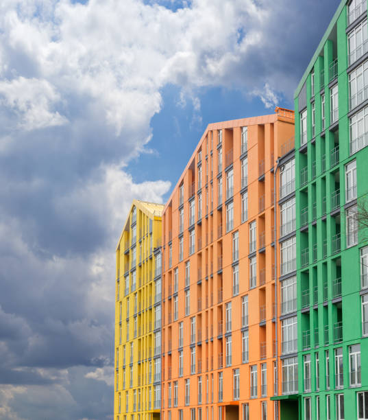istock Fragment of a multicolored facade of the modern apartment complex 655671624