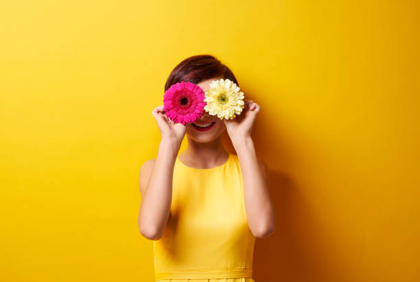 istock Playful brunette covering her eyes 655678256