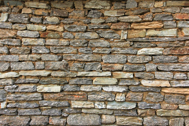istock Natural grunge brown stone wall background and texture 655689348