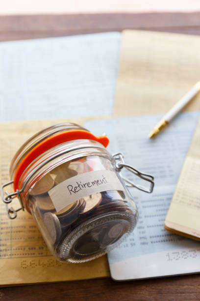 istock Retirement money in a jar and  saving account passbook 655691444