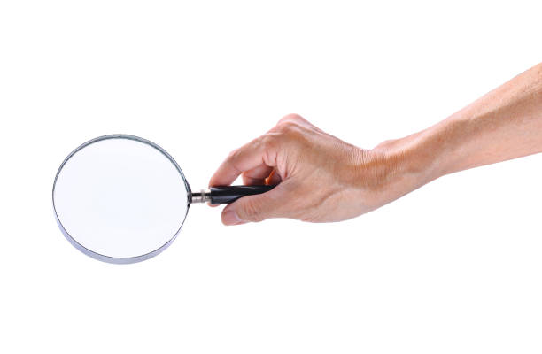 istock man hand holding magnifying glass isolated on white background 655693418