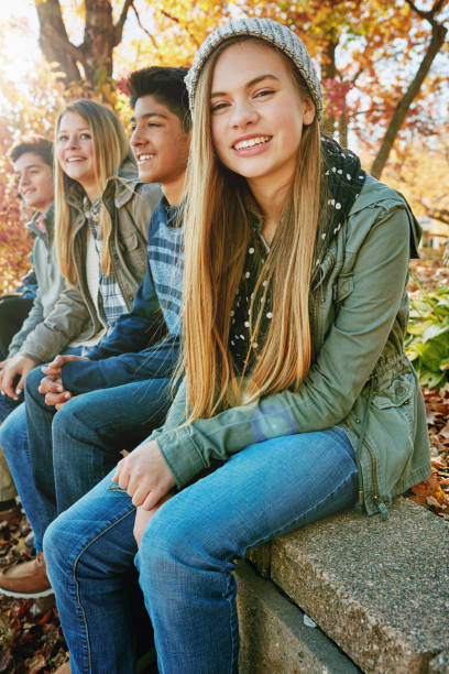 These guys are the best Portrait of a group of young friends enjoying a day at the park together teenagers only stock pictures, royalty-free photos & images
