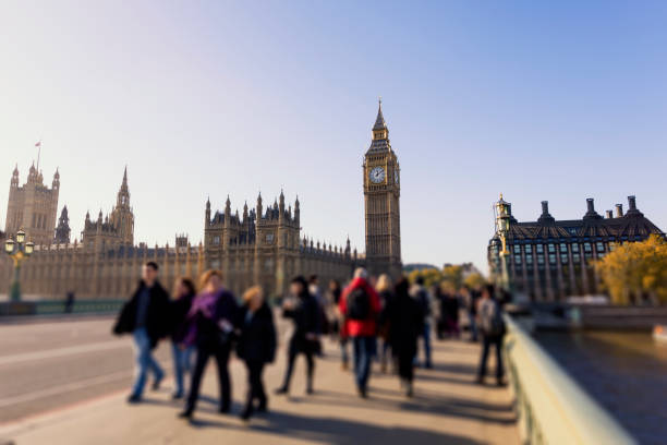istock Tilt shift blur with crowd of people walking on Westminster Bridge 655696672