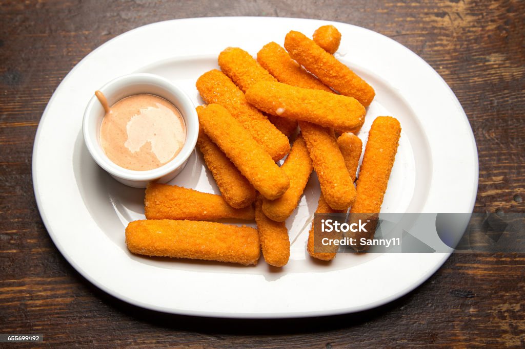 sticks with mozzarella cheese Traditional beer snack sticks with mozzarella cheese, deep fried, with sauce Breaded Stock Photo