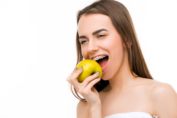 istock Beautiful young woman with teeth braces 655699718