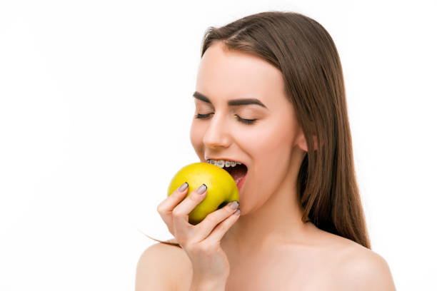 istock Beautiful young woman with teeth braces 655699802