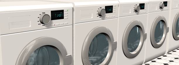 istock Washing Machines in an empty room with a shiny tiled floor 655704336
