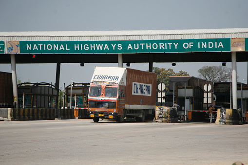 A truck passes from a toll tax collection booth on National Highway -2 near etawah, uttar pradesh India.