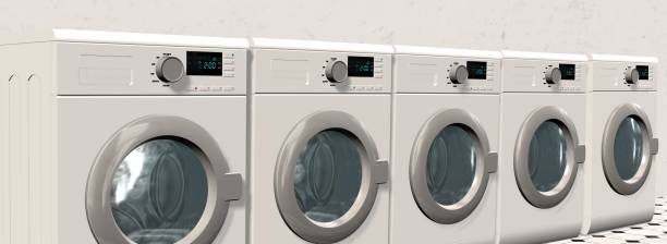 istock Washing Machines in an empty room with a shiny tiled floor 655707438
