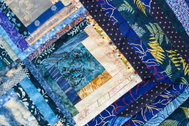 istock The colored patchwork quilt with blue geometry pattern. Part of Colorful Scrappy blanket 655707472