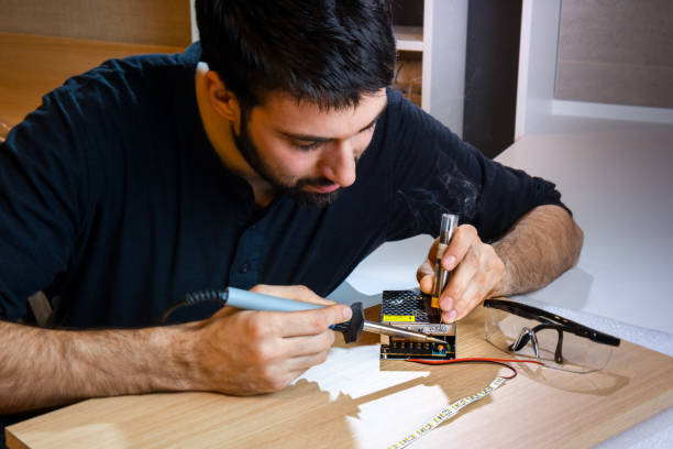 istock Electrician soldering wires 655708272