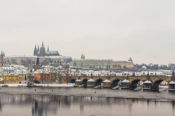 istock St Vitus Cathedral and Charles Bridge covered in snow 655711264
