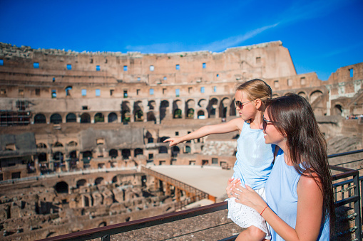 Happy family in Rome over Colosseum background