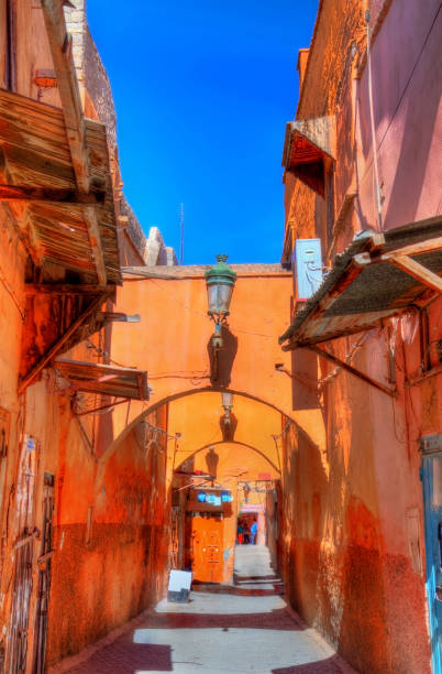 Street in Medina of Marrakesh, a UNESCO heritage site in Morocco Street in Medina of Marrakesh, a UNESCO world heritage site in Morocco marrakesh riad stock pictures, royalty-free photos & images