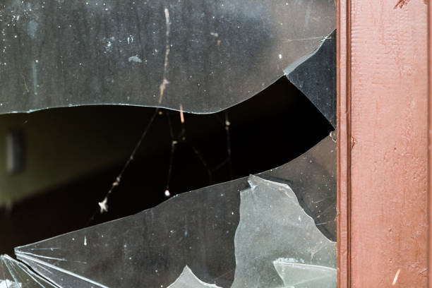Window with broken glass in very old house