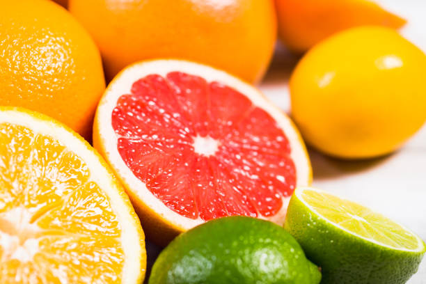 istock Fresh citrus fruits on a brown wooden table 655725502