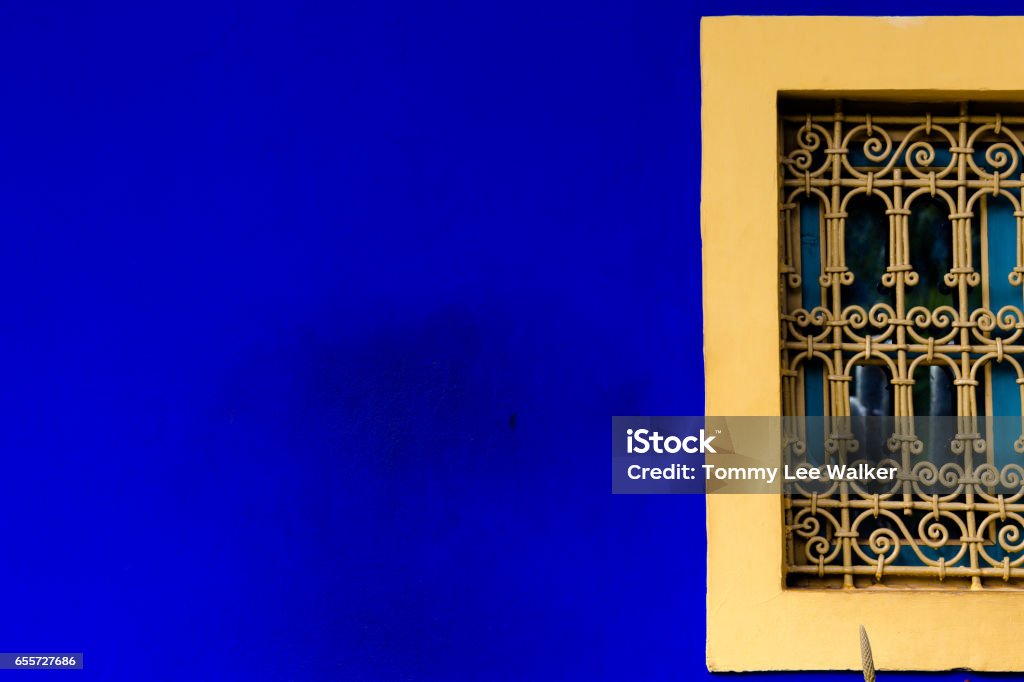 Solid bold blue and orange abstract backgrounds Abstract wall corners and edges in contrasting colours blue and yellow making illusion Abstract Stock Photo